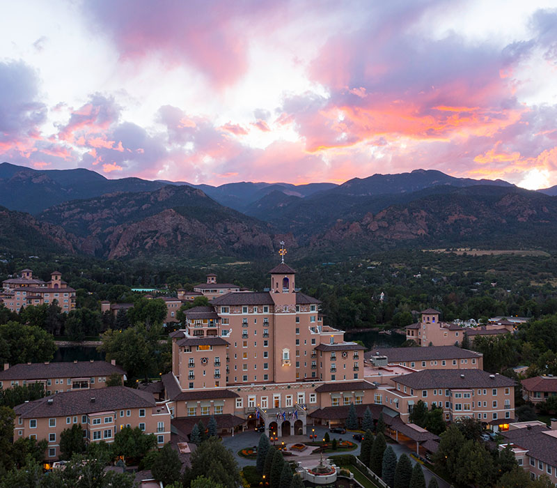 Sunset over the mountains and rooftops of Colorado Springs