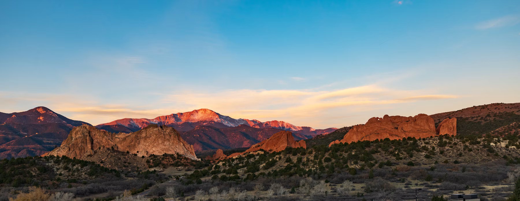 Sunrise on Pikes Peak above the red rock formations of Garden of the Gods in Colorado Springs